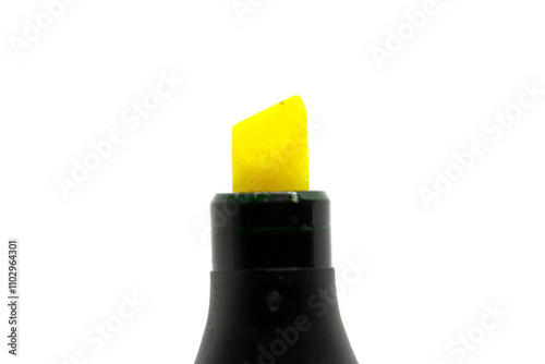 Detailed view of a bright yellow highlighter tip against a plain white background, emphasizing stationery, office supplies, and creative expression. Ideal for education or artistic themes.