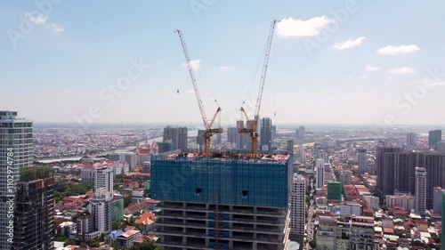 New building under construction using industrial crane Phnom Penh Cambodia