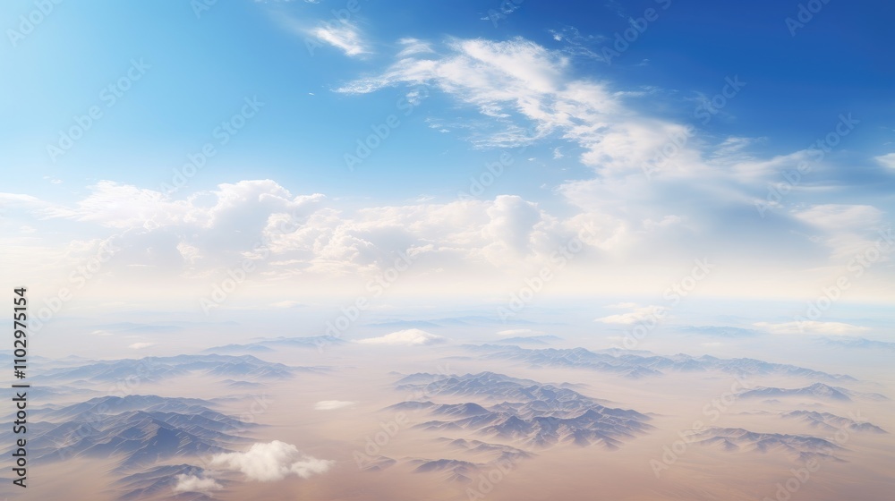 Aerial view of vast and barren desert landscape under a bright blue sky with scattered clouds showcasing natural beauty and tranquility Aerial view of vast and barren desert landscape under a bright blue sky with scattered clouds showcasing natural beauty and tranquility