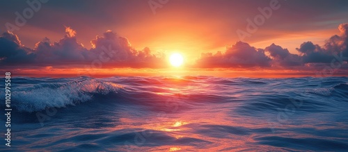 Serene sunrise over ocean with golden sun and colorful clouds reflecting on gentle waves creating a tranquil morning atmosphere