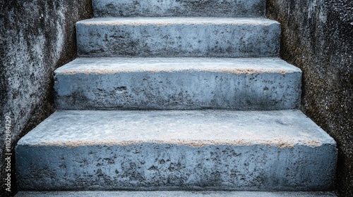 Concrete stairs leading up and down in an urban setting showcasing a textured surface with weathered appeal and practical functionality. photo