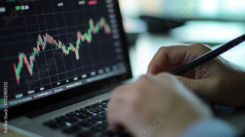 Analyzing Stock Market Trends: Close-up shot of hands analyzing stock market data on a laptop, focusing on strategic decision-making and financial analysis.