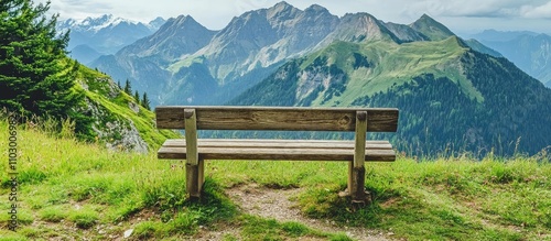 Scenic wooden bench overlooking majestic mountain range with lush greenery in the foreground ideal for relaxation and nature appreciation