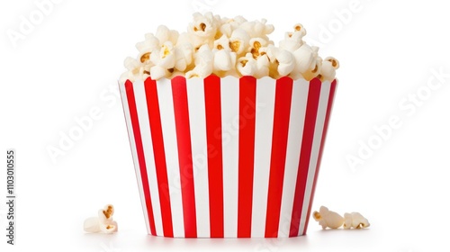 Freshly popped popcorn overflowing in a classic red and white striped container on a clean white background. Perfect for snacks and cinema themes. photo