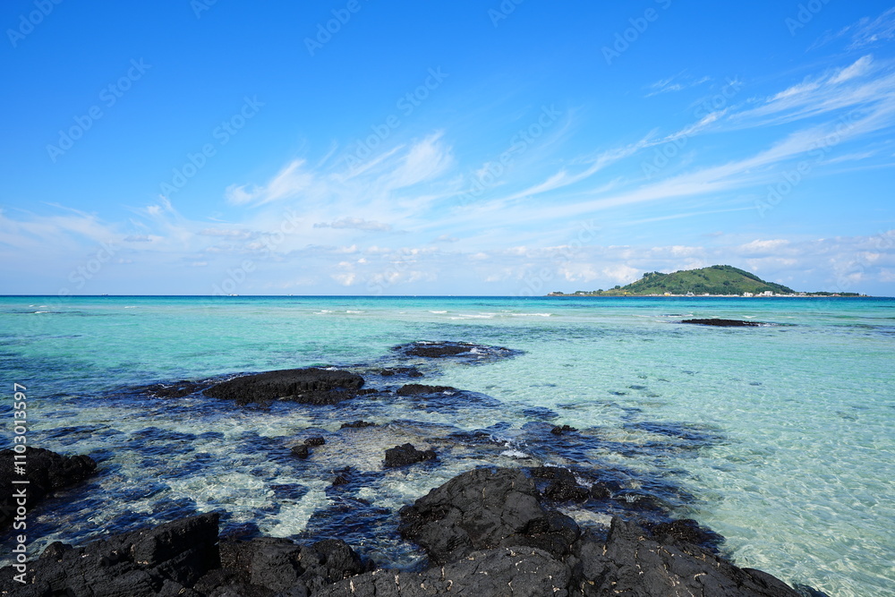 clear shoaling beach and mossy rocks in the sea clear shoaling beach and mossy rocks in the sea