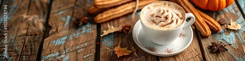 Pumpkin latte with cinnamon and sugar churro on a wooden background