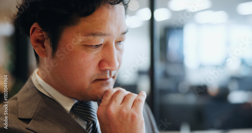 Thinking, businessman and ideas in office, serious and planning for opportunity, investor and stock market. Finance, wondering and Asian person in corporate, contemplating and stockbroker in Japan