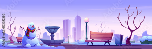 Snowman in scarf stands near frozen fountain in snowy public park. Bare trees in winter urban landscape with downtown skyscrapers backdrop. Empty wooden bench, lamppost, and trash bin covered in snow