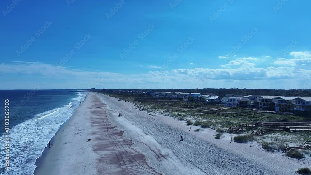 Figure Eight Island is a barrier island in the U.S. state of North Carolina and see and cloudy sky Figure Eight Island is a barrier island in the U.S. state of North Carolina and see and cloudy sky