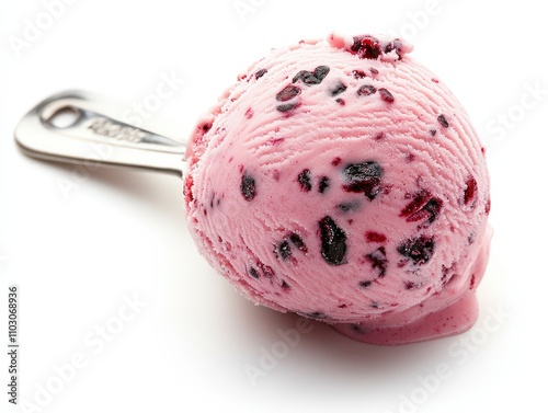 A delicious scoop of berry-flavored ice cream served with a metal scoop, perfect for summer desserts and sweet treats. photo