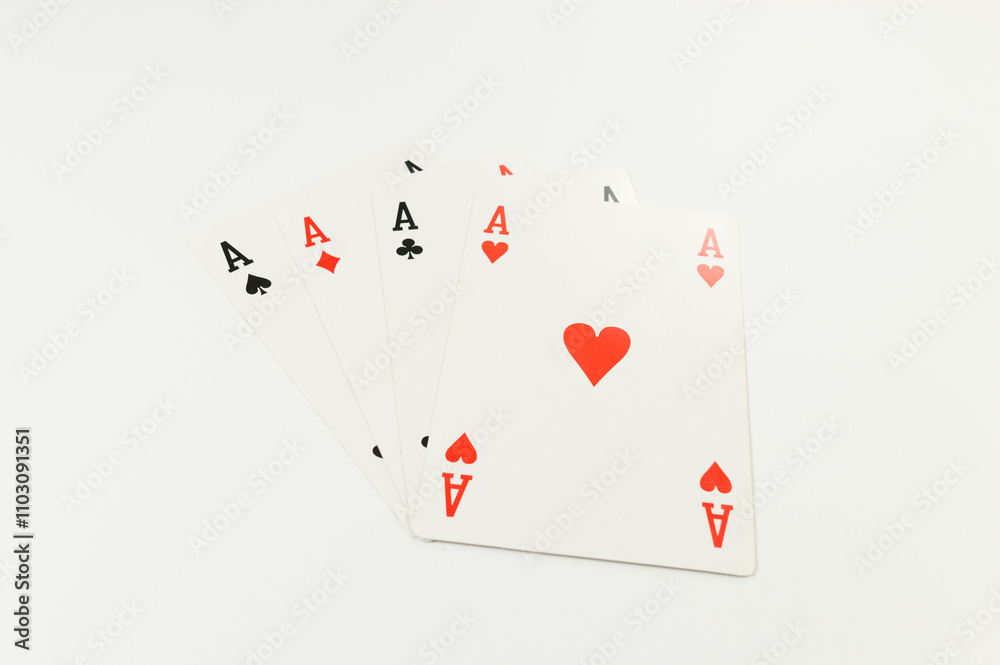 Top view of playing cards on white background. Four aces cards, board game, poker. Copy space, flat lay. Top view of playing cards on white background. Four aces cards, board game, poker. Copy space, flat lay.