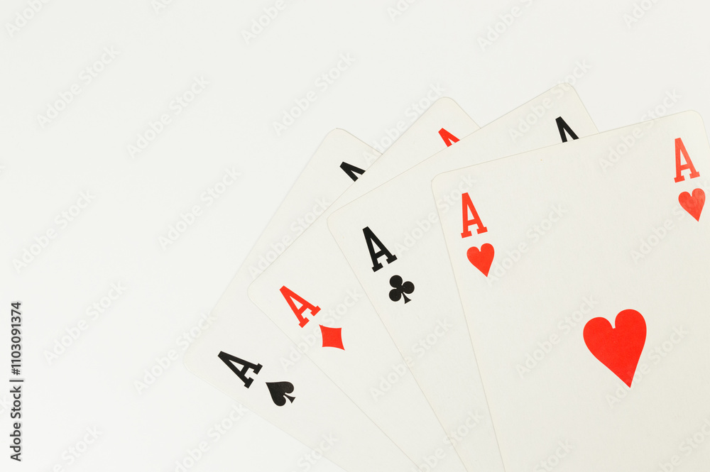 Top view of playing cards on white background. Four aces cards, board game, poker. Copy space, flat lay. Top view of playing cards on white background. Four aces cards, board game, poker. Copy space, flat lay.