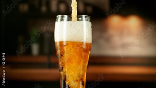 Close-up of beer pouring in...