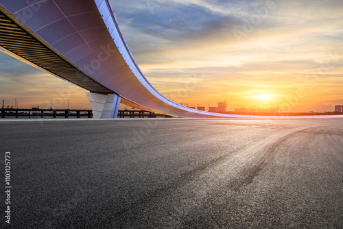 Obraz na płótnie Asphalt road and bridge with sky clouds nature landscape at sunset. car background. w salonie
