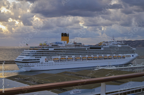 Modern Italian cruiseship cruise ship liner Fascinosa during sunset in port of Marseille Provence, France during summer Mediterranean cruising photo