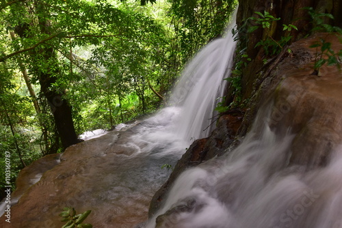 Travel to waterfalls during the rainy season, The tiers of the waterfall contrast beautifully with the sky