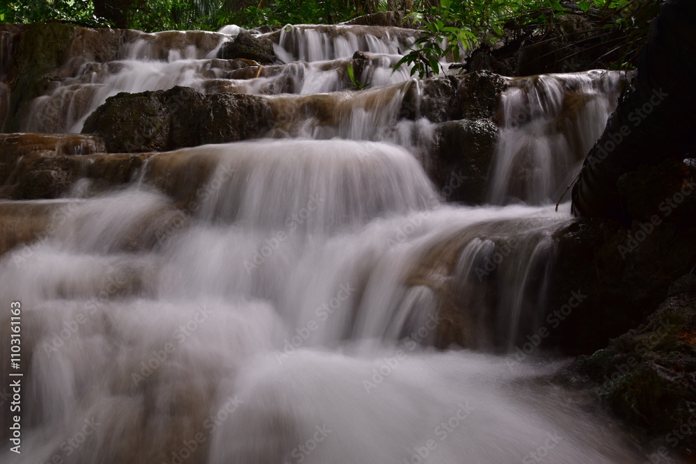 Travel to waterfalls during the rainy season, The tiers of the waterfall contrast beautifully with the sky Travel to waterfalls during the rainy season, The tiers of the waterfall contrast beautifully with the sky