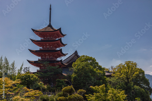 Pagoda over the trees at itsukushima shrine photo