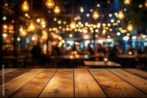 Wooden table surface with a blurry background of a restaurant with warm lights.