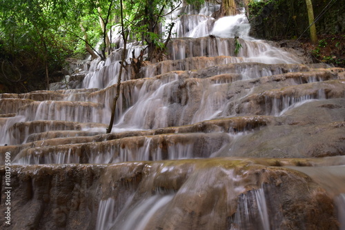 Travel to waterfalls during the rainy season, The tiers of the waterfall contrast beautifully with the sky, Nature itself is the best physician photo