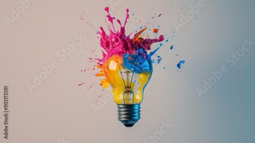 A vibrant splash of colorful paint emerging from a lightbulb, symbolizing a burst of creative ideas, isolated on a clean white background. photo