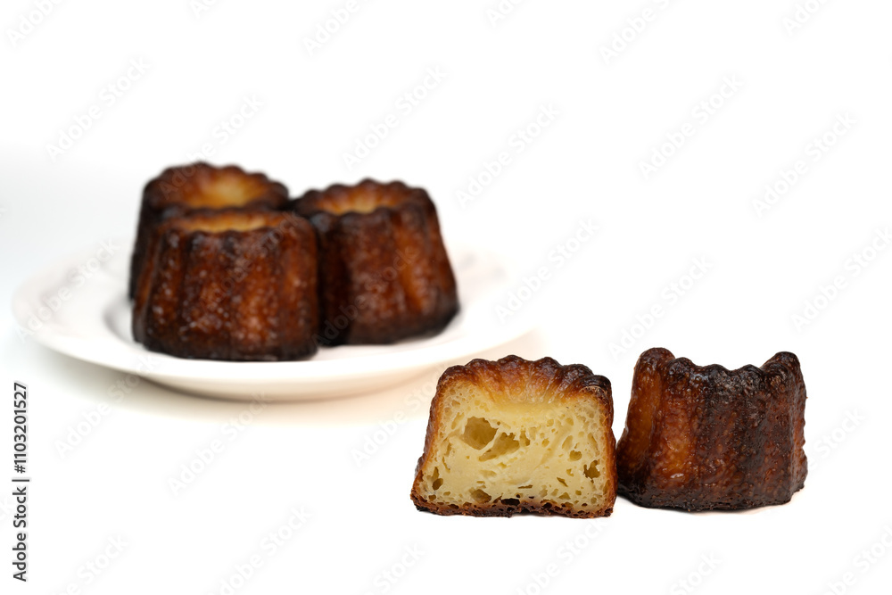 Caneles de bordeaux, traditional French sweet dessert with white table background, High quality photo Caneles de bordeaux, traditional French sweet dessert with white table background, High quality photo