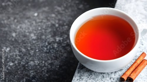 Warm Cup of Tea with Cinnamon Sticks on Countertop