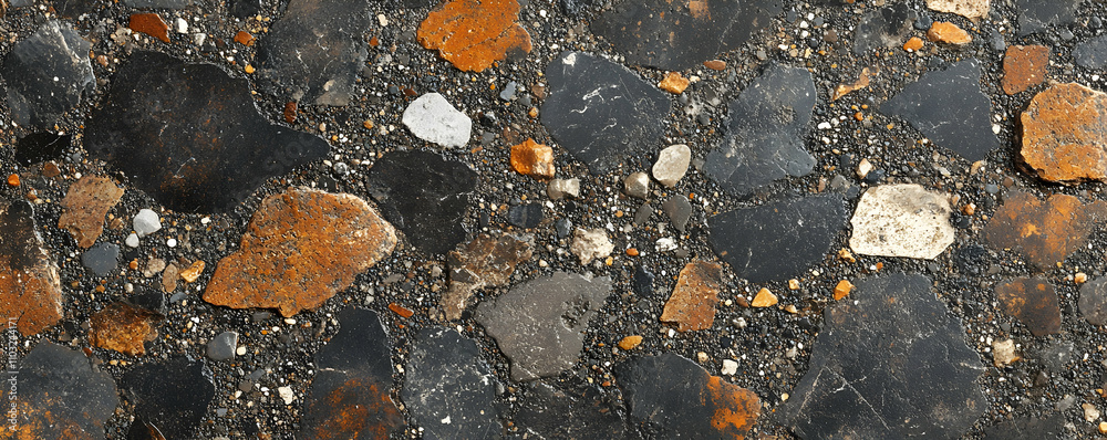 Close-up of dark gray, black, and orange stones. Close-up of dark gray, black, and orange stones.