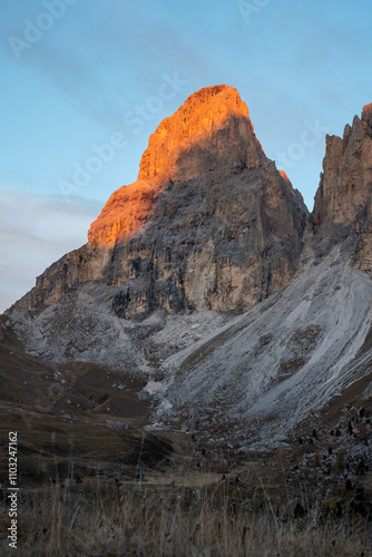 Sunrise alpenglow on the limestone peak of Sassolungo