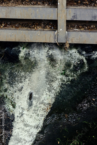 This is the sewer channel of almost dead, clusters of dead organic matter. Muddy water due to the abundance of hydrogen sulfide photo