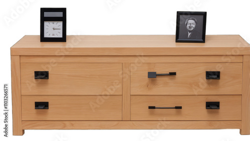 Light wood dresser with four drawers, black handles, clock and framed photo on top transparent background
