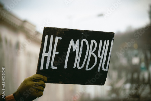 hands holding a sign during rally dedicated to POWs