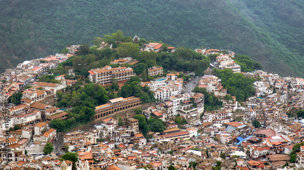 Beautiful view of the hillside town of Taxco de Alarcon in Mexico during a cloudy day Beautiful view of the hillside town of Taxco de Alarcon in Mexico during a cloudy day