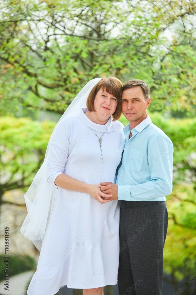 An adult bride and groom . Husband and wife's wedding anniversary photo shoot. We've been together for 30 years. An adult bride and groom . Husband and wife's wedding anniversary photo shoot. We've been together for 30 years.