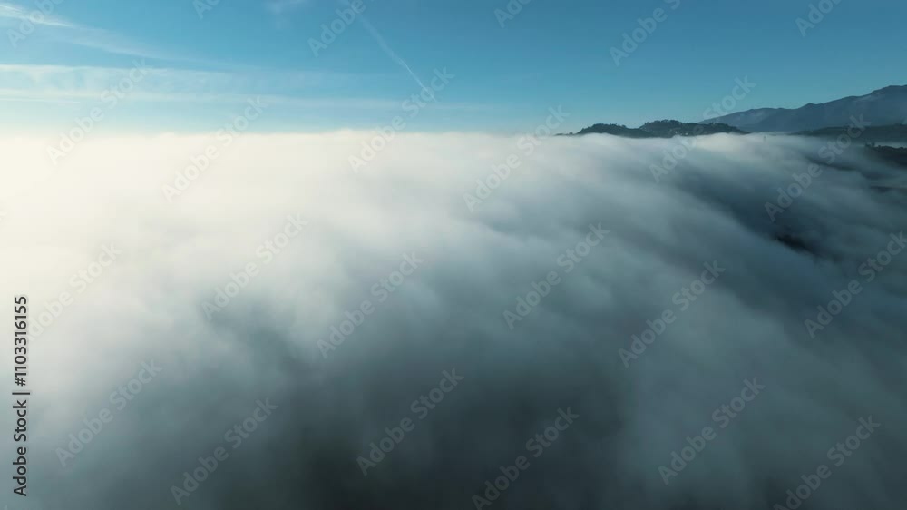 Aerial view of Vila Real city and hills in Portugal above clouds Aerial view of Vila Real city and hills in Portugal above clouds