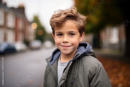 portrait of a cute little boy on the street in the city