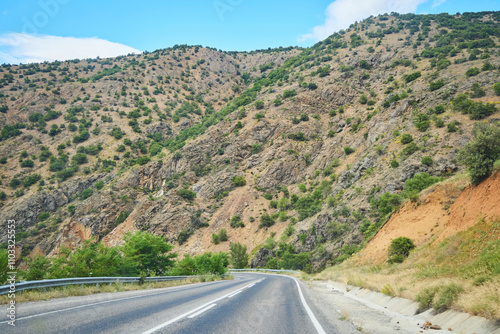 A beautiful landscape with a road stretching into the distance. The Anatolian region of Turkey. The time of the year is summer. photo