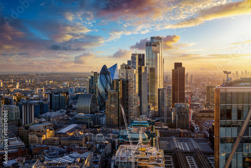 Fototapeta Naklejka Na Ścianę i Meble -  Elevated view of the City of London with the financial skyscrapers and Tower Bridge in the background during golden sunset time