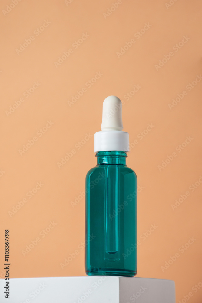 Blue glass cosmetic bottle, Skin care or sunscreen cosmetic with stylish props on cream background. Blue glass cosmetic bottle, Skin care or sunscreen cosmetic with stylish props on cream background.