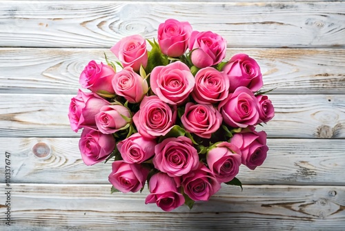 A Stunning Bouquet of Pink Roses on a White Wooden Background - Top View with Copy Space for Elegant Designs and Floral Arrangements