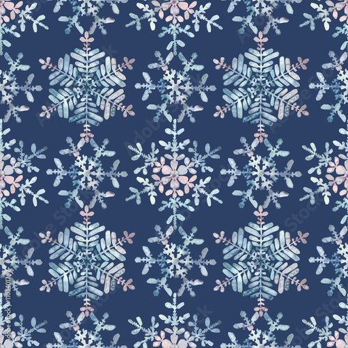 Seamless winter pattern. Granulation watercolour snowflakes on a blue background. Hand drawn illustration. Frost crystals drawn by hand. For fabric, sketchbook, wallpaper, wrapping paper, invitation