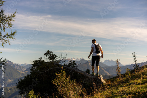 A person on a mountain top photo