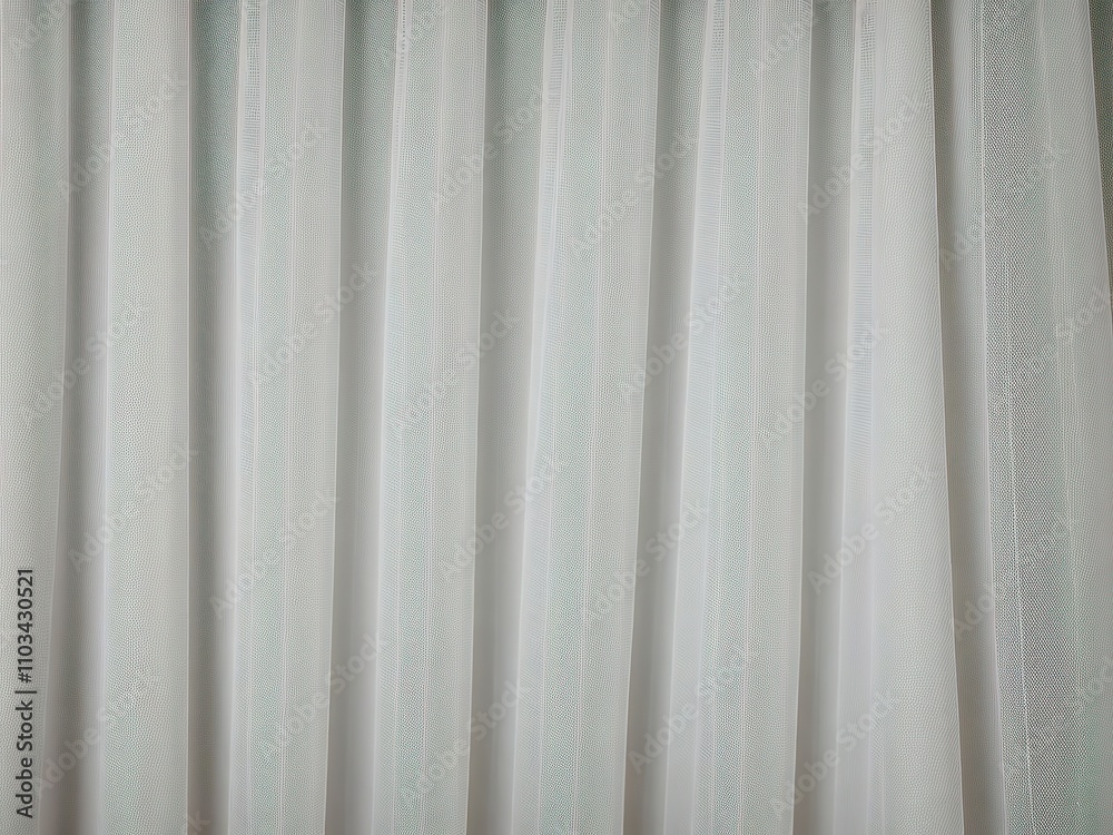 White sheer curtains with vertical folds. White sheer curtains with vertical folds.