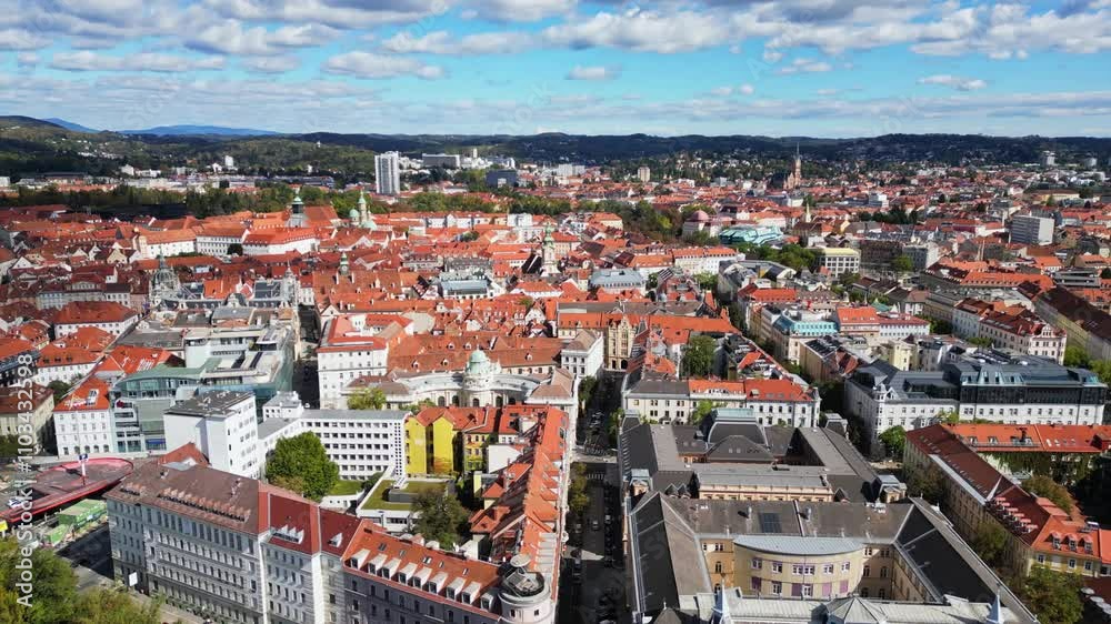 Aerial view of beautiful cityscape with historic buildings and red roofs, Graz, Austria.