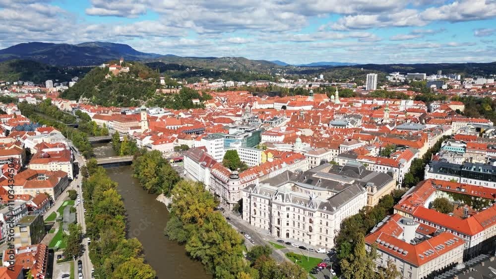 Aerial view of beautiful cityscape with historic buildings and the river Mur, Graz, Austria.