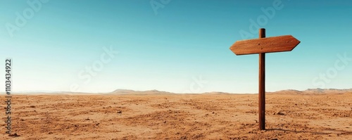 A solitary wooden signpost in a vast desert landscape under a clear blue sky, symbolizing direction and adventure in the wilderness.