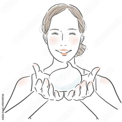 両手で泡を持っている笑顔の女性の上半身