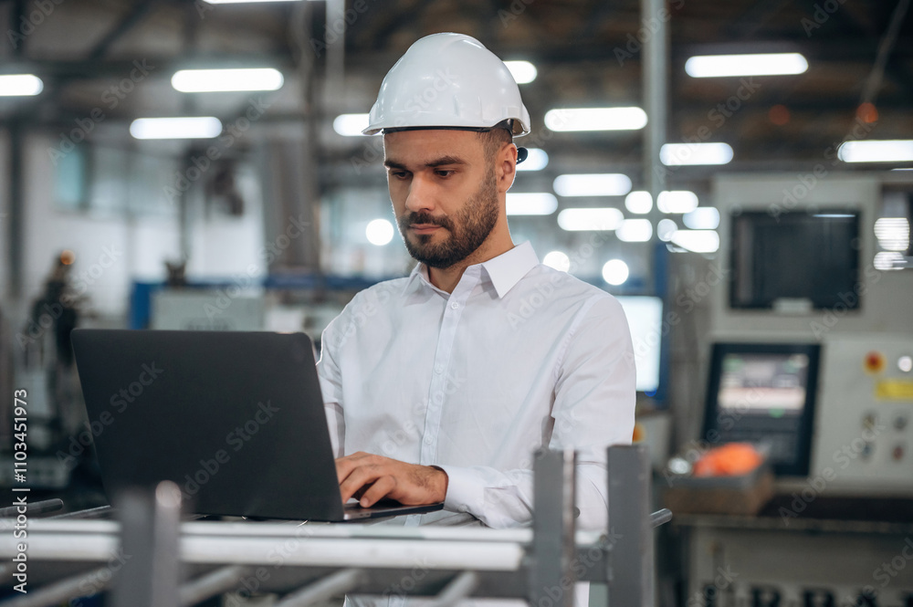 Busy at work. Man is in the modern factory Busy at work. Man is in the modern factory