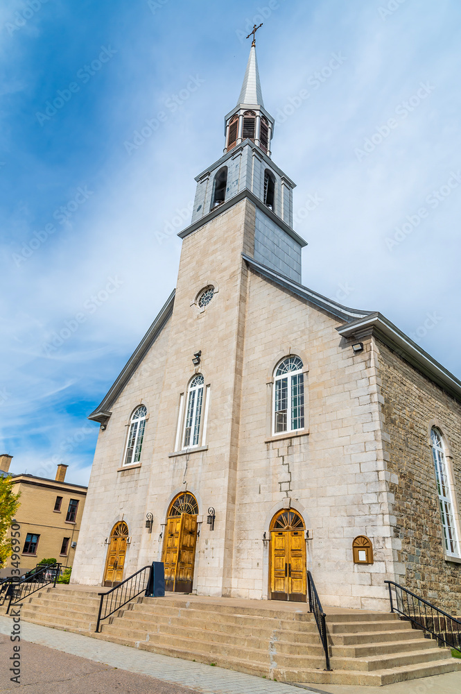Fototapeta premium A view towards the church of Saint Alfonso in the bay at Saguenay, Quebec in Canada in the fall
