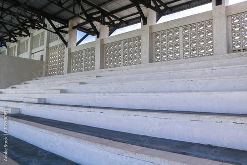 Yogyakarta State University gymnasium swimming pool seating. white Stairs Facility climb steps photo